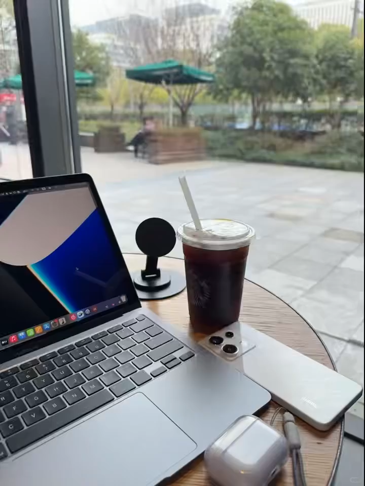 Coffee, laptop, and a view—perfect recipe for a productive day! ☕️💻 #WorkVibes #CaféCulture