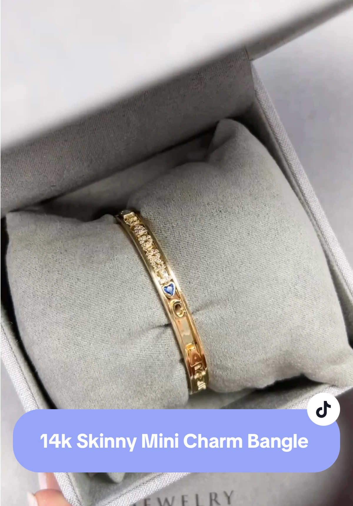 Come build the 14 karat gold skinny mini charm bangle with us. A lifetime investment that holds your most precious memories and molestones ##braceletstacks##jewelrytiktok##charmbangles##charmbracelets##uniquejewelry##viralbracelet