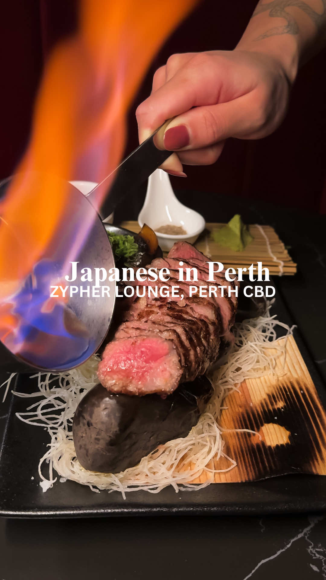 This might just be the best steak deal in Perth right now... 🥩 For a limited time, you can enjoy top-grade A5 Kagoshima Wagyu, the world’s most luxurious steak, for just $100 at @Zypher Lounge - a sleek Japanese fusion restaurant in the heart of Perth’s CBD. Available Wednesdays and Thursdays throughout August, it’s the kind of indulgence that’ll elevate your week from ordinary to unforgettable. Served with mixed mushrooms, kombu salt, wasabi and black garlic, this rare Japanese Wagyu is intensely marbled, buttery-soft, and absolutely melt-in-your-mouth. Ordinarily the domain of Japan’s top-tier restaurants, it’s now on offer at Zypher for a fraction of the usual price ($180). While the A5 Wagyu is the star of the show, we couldn’t resist sampling more of Chef Evan Bang’s bold and creative Japanese fusion plates - crispy rice tuna poke, teriyaki wagyu tacos, mentaiko corn, and crispy eggplant with sweet miso (honestly - this dish was unbelievably delicious). Pair your meal with a sake flight or one of Zypher’s stunning cocktails inspired by Tokyo’s nightlife – we loved the Lilac Lychee and Crimson Jade. 🍸 And for dessert? 🍓 The Daifuku with Strawberry Sorbet was a perfect, pretty finale. Whether you’re planning date night, a midweek catch-up, or simply love incredible Japanese food, Zypher Lounge delivers flavour, style and serious late-night vibes under one roof. This A5 Wagyu special runs through August only - bookings essential! 📍 414 Murray Street, Perth CBD 🕔 Wed & Thurs: 5pm-12am | Fri & Sat: 3pm-12am . . . . . . #Perth #perthfood #japanesefood #perthjapanese #japaneserestaurant #wagyu