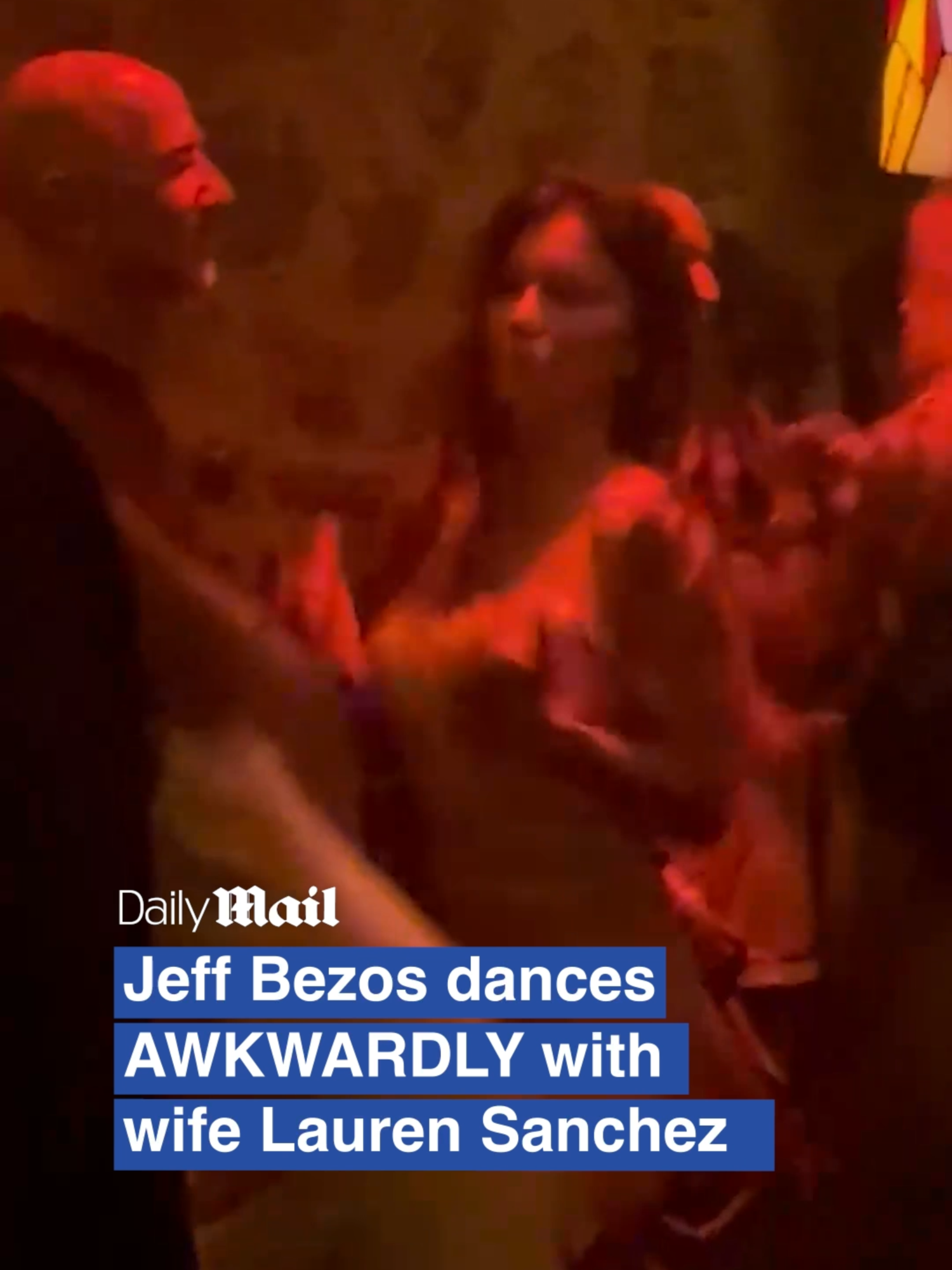 Lauren Sanchez dances awkwardly in front of a VERY stiff Jeff Bezos inside Ibiza nightclub. For the full video head to DailyMail.