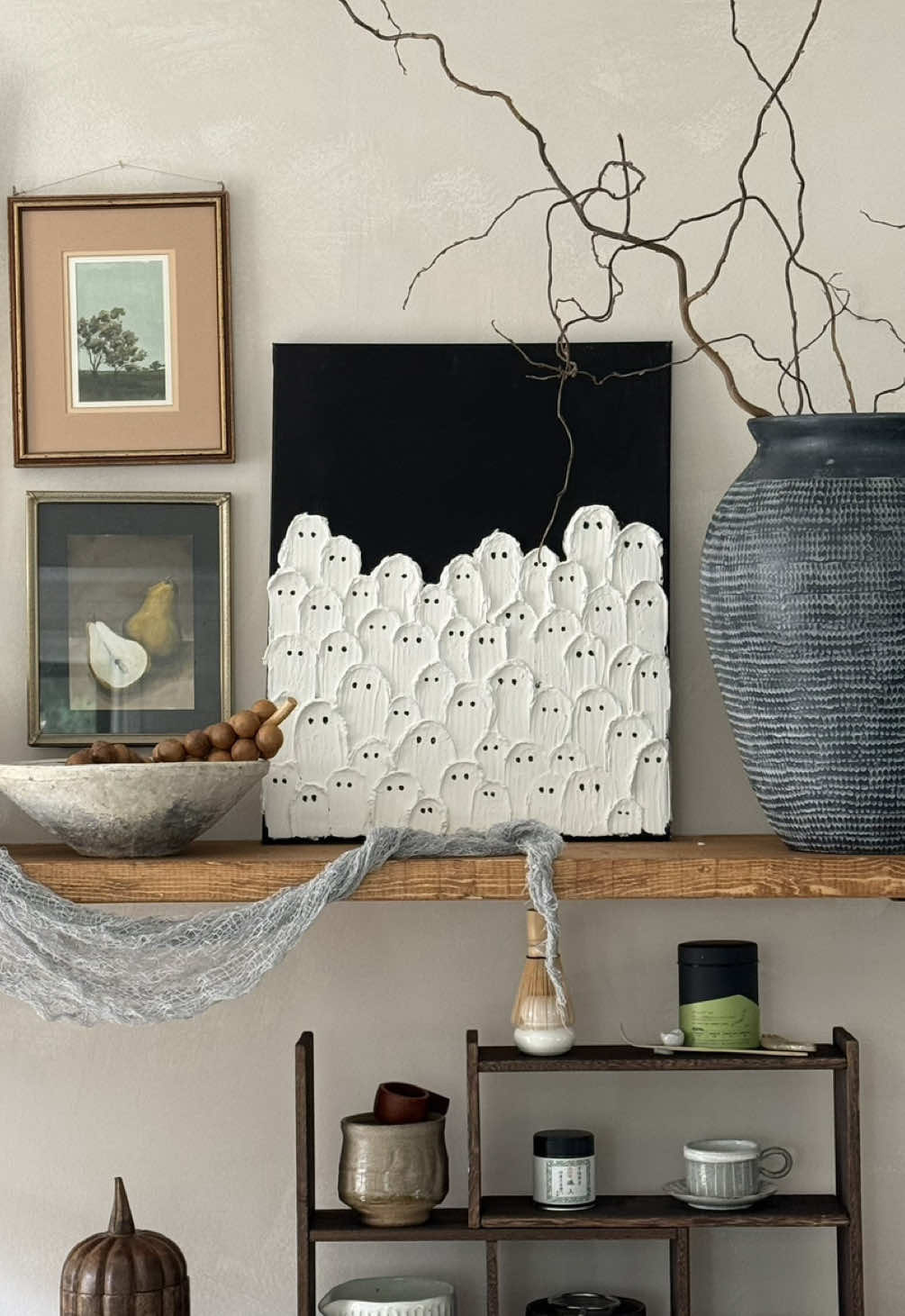 This viral ghost painting is so easy to recreate! I bought most of my supplies at the dollar store and if you don’t have spackle on hand, you can mix your paint with baking powder for a thick painting consistency. My number one tip for this craft is to start smearing your ghosts from top to bottom. Make sure to separate the ghost smears and not clump them together when you’re going to give clear definition of their shapes. This was so fun and easy to do! #halloweendecor #halloweendiy #halloweencraft #halloweencrafts #ghostart #diycraft