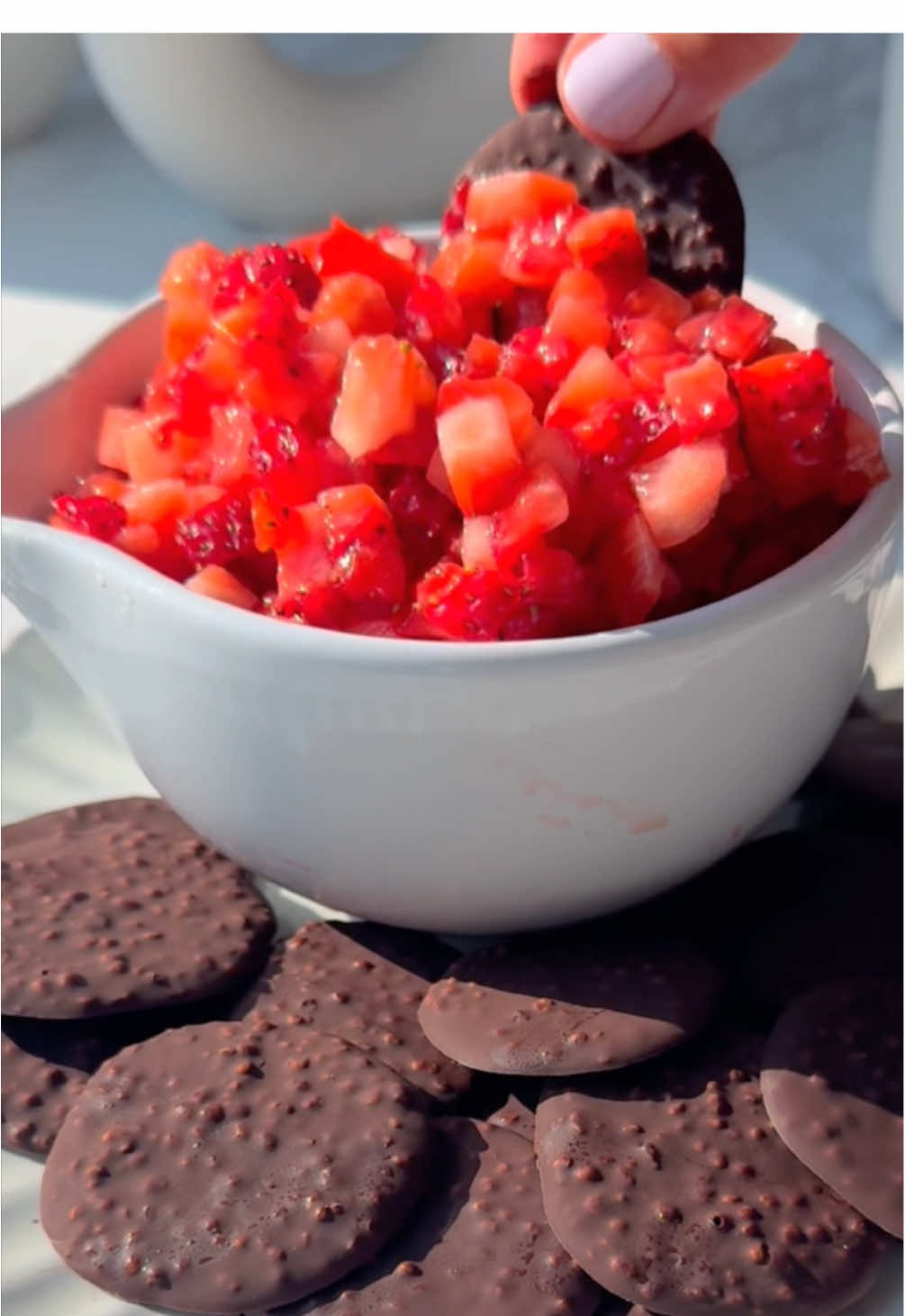 Recipe linked in bio or find it here: https://www.eatingbyelaine.com/strawberry-chocolate-chips-and-salsa/ ❤️🤎 Viral Chocolate “Chips” & Strawberry “Salsa” 🍓🍫 (with an extra crispy twist). TikTok made me do it… and I’m so glad I did. It’s the best way to enjoy strawberries and chocolate together. 👇 Comment “STRAWBERRIES” and I’ll DM you the full recipe!This no-bake treat summer snacking goals. Just a couple ingredients, totally customizable and honestly...better than chocolate-covered strawberries (yep, I said it). I love that you can control the ratio of chocolate to strawberries with every bite. I added crispy quinoa to my chocolate for a subtle crunch that makes them feel extra chip-like. We’re not using raw quinoa here or toasted or even puffed quinoa - crispy quinoa is what you need and I share the details in the recipe post. It’s my twist on the viral version and the texture is 💯 worth it. But either way? Total crowd-pleaser.You can even swirl almond butter into the melted chocolate for a fudgy, nutty upgrade or serve it with my easy coconut whipped cream on the side (DO IT). You can also pour the melted chocolate into a flat layer like bark, then break it into “chips” which so fun and just as delicious. With this version you can add white chocolate chips or dye-free sprinkles too to make it extra festive. No matter how you do it it’s truly chocolate-strawberry perfection in every bite and my kids went wild for it ❤️🤎#strawberrychipsandsalsa #strawberrysalsa #viralstrawberrysalsa #strawberrysalsachocolatechips