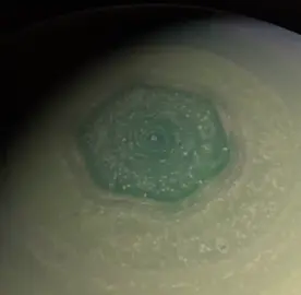 The hexagonal cloud pattern at Saturn's north pole as seen by the Cassini spacecraft. Each side of the hexagon is about 14,500 km (9,000 miles), larger than the Earth's diameter.