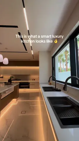 Take a peek inside this modern luxury kitchen by Al Meera. ✨ Smart and satisying 👌  #homeinterior #bespokehome #smartkitchen #luxurykitchen #kitchendesign  