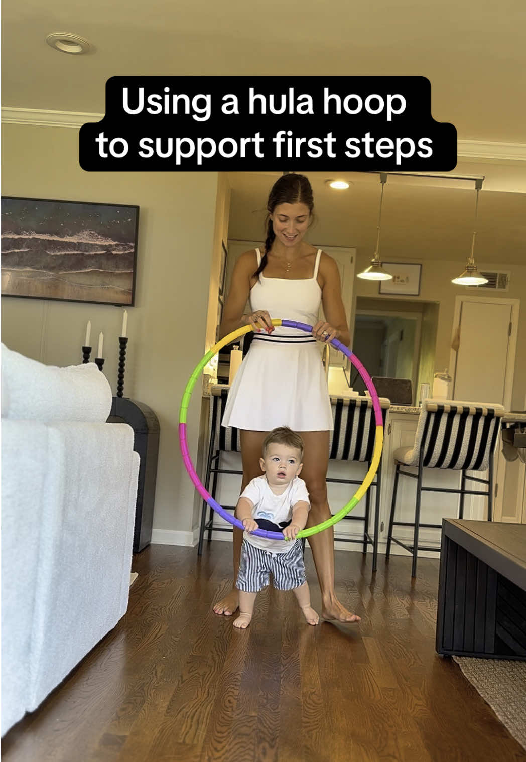 Did you know you can use a hula hoop to support first steps? Great for balance, posture, and most importantly FUN! #firststeps #babywalking #parentinghacks #firsttimemom #sahm #fyp #foryou #baby #milestones #babymilestones #babywalkingfirsttime #hulahoop 