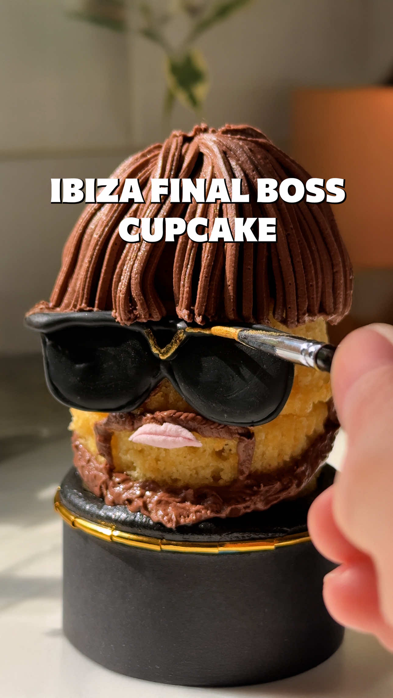 Enter the Ibiza Final Boss Cupcake... @jack.kayy1 , how did we do? Method: Stick together 2 small cupcakes with a little buttercream Using a Grass Nozzle pipe brown buttercream for the hair - A bowl cut is ESSENTIAL. Piped glasses using black candy melts, place in the fridge to firm. Lips - snip the edges of a large pink marshmallow. Use the samel brown buttercream to pipe the facial hair. Place on top of a black buttercream swirl to finish.