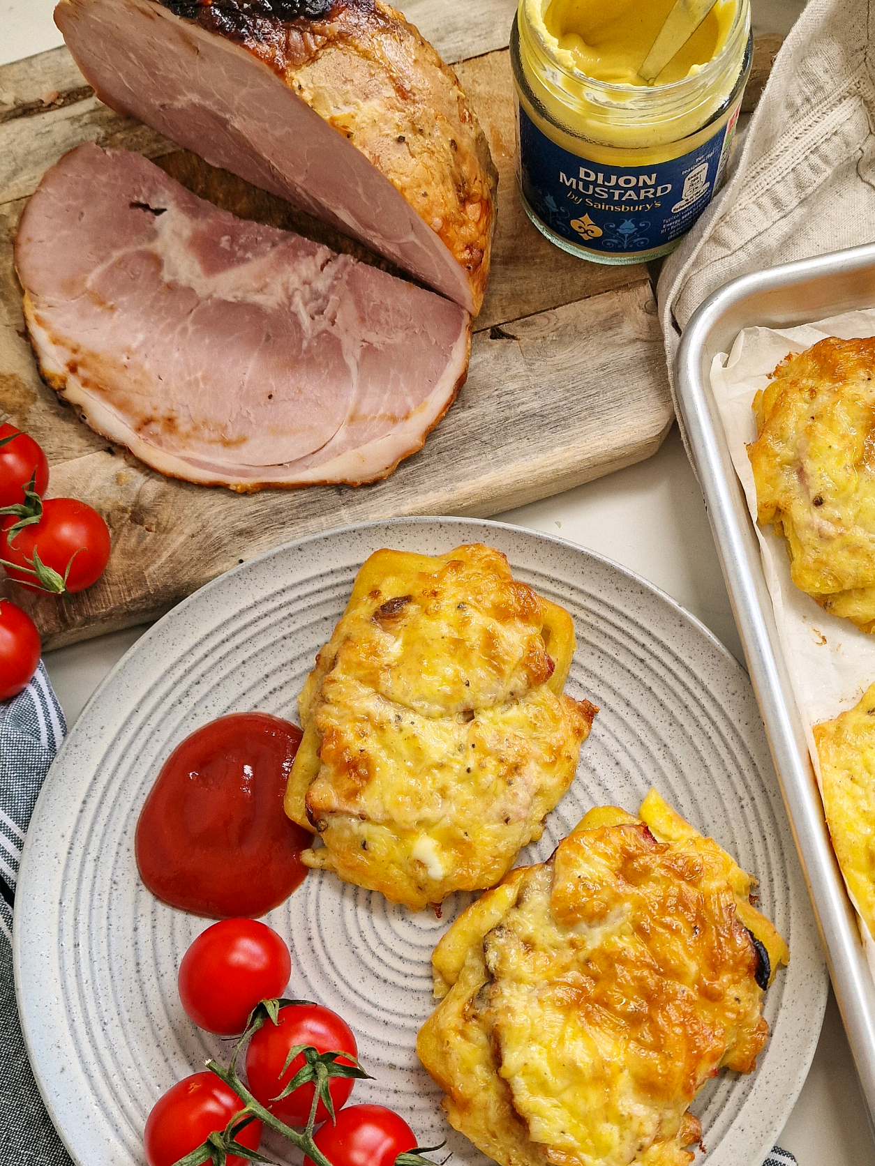 Baked Cheggy Waffles A few years ago, my friend's son named my cheesy ham and egg toasts 'Cheggy Bread' - he was only little and the name just kind of stuck! Well, this is the potato waffle version! I airfried a ham this week. During the holidays those little packets of the sliced stuff lasts less than a day in our house...This was the perfect way to use it! Potato waffles topped with the ham then finished off with a cheesy, eggy, mustardy mix! It's basically a cheat's ham, egg and chips - It really shouldn't taste as incredible as it does! I have written up the recipe for this below, let me know if you're going to give it a try this weekend! A x Makes 6-8 Waffles 6-8 frozen potato waffles 150g grated cheddar cheese 2 eggs beaten 1/2 tsp Dijon mustard Ground black pepper Sliced ham Heat the oven to 200C fan Place 6-8 potato waffles on a baking tray. Cook for 10 minutes. Mix the grated cheese, beaten egg, dijon mustard and black pepper together. Tear up the ham slices. Remove the waffles from the oven and turn the heat down to 180C fan Divide the sliced ham between the waffles. Spoon the eggy cheesy mixture evenly over the waffles. Return to the oven for 15-18 minutes or until cooked through. #ham  #airfryer  #eggrecipes  #lunchideas  #airfryerrecipes  #easydinner  #quicklunch 