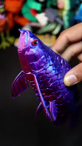 3D-Printed Arowana. 📁File: Makerworld 🖨️Printer: @BAMBULAB Official A1 AMS Filament: @elegoo Silk PLA Red-Blue. #asmr #3dprinting #3dprinted #3dprint #videooftheday #bambuseful #fidget #arowan 