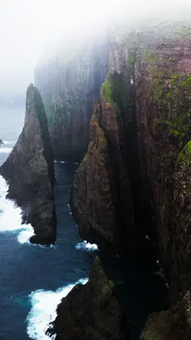 The cliffs stand like sentinels, guarding the secrets of a restless sea ~ . . . #MoodyLandscapes #EpicNature #DarkParadise #DramaticSeas #OceanCliffs #FaroeIslands #WildAndFree #EarthsEdge #NaturePhotography #TravelPhotography #LandscapeLovers #MoodyVibes #AdventureAwaits #SeascapePhotography #NaturePerfection 