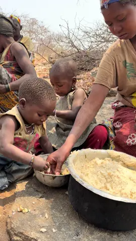 Mother and kids eating Ugali😋#hadzabetribe #eating #feed #kidstiktok #fyp 