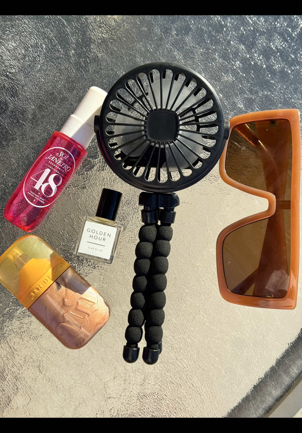 Pool Day Necessities pt 1 🌊☀️ It’s too hot to not bring a fan to the function so I’m not going anywhere without my SPF, fragrances, and fan!  #poolday #summerscents #soldejaneiro #fragrancefun #sandandfog  @Saie @urban decay @SAND + FOG  @Sol de Janeiro 