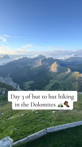 🌄Day 3 of our Dolomites hut-to-hut hike started with one of the best sunrises yet.  🥾When Walter asked me if I wanted to skip the via ferrata and take a solo route, I jumped at it. I love hiking alone, going at my own pace, stopping to take it all in.  🇮🇹Back in Cortina, it was all about swapping clothes, a long shower, and watching the town prepare for the 2026 Winter Olympics.  ➡️Would you keep hiking hut-to-hut or mix in a hotel night? Follow along because day 4 is next! #dolomites #Hiking #cortina #hikingtrip #dolomitesitaly 