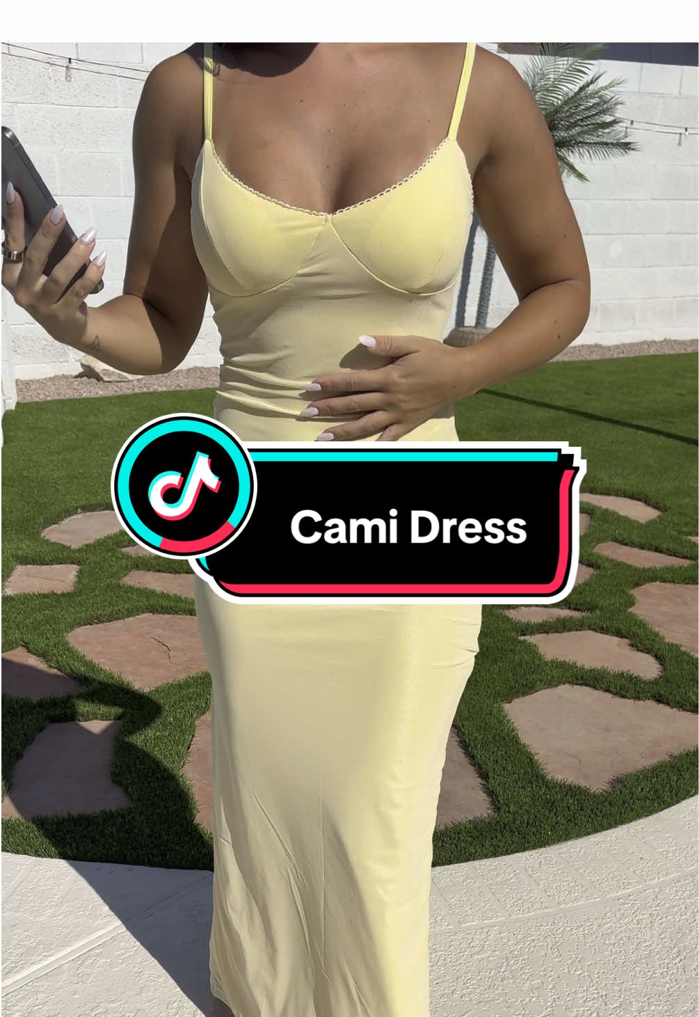 This cami dress is soooo cute! The design and fit are perfect. #camidress #vacationdress #yellowdress #vacationdresses #cutedresses 