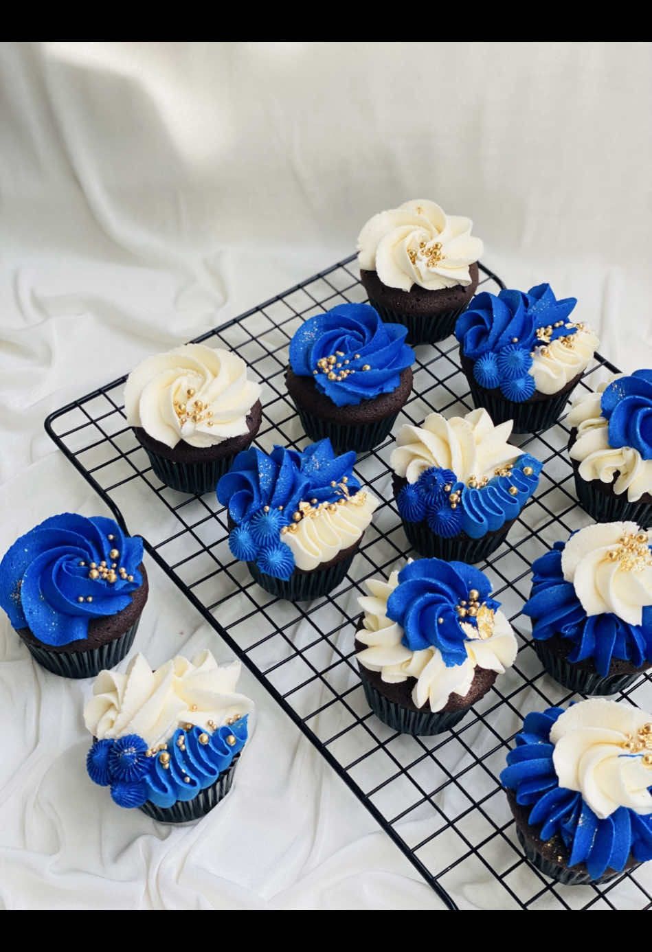 ✨ 💙 When elegance meets indulgence… these cupcakes aren’t just desserts, they’re little works of art! Rich chocolate bases topped with silky swirls of royal blue & creamy white buttercream, kissed with golden pearls for that extra touch of luxury. Every bite is a celebration — perfect for weddings, birthdays, or simply spoiling yourself because you deserve it! 🧁💫 ✨ ✨Pre-order yours today before they’re gone!✨ ✨Call us to place your order now ✨ 📞Contact number 0772151999 / 0722985113 . . .  . . #cupcut #tiktok #CupcakeLove #EdibleLuxury #ButtercreamDreams #RoyalBlueCupcakes #BakingWithLove #CakesOfInstagram #ElegantCakes #sugardreamcakes #foryoupage #fypシ #trending  #baking #Love #cakeartist #cakelover #chef #cakechef #delicious #instagram #instagood #happybirthday #elegantcake #newdesign  #foryoupage #fyp #fypシ #trending #viral #viralvideo #followme #following #fyppppppppppppppppppppppp #onemillionaudition #onemillion #birthday #birthdaycupcakes  