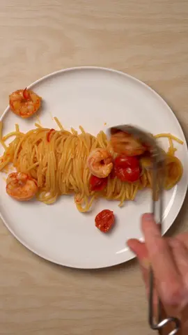 Spaghetti with Argentine Prawns, Cherry Tomatoes and Chili Ingredients   * 250 to 280 g spaghetti   * 200 g Argentine prawns (preferably sustainably sourced)   * 1 garlic clove, finely chopped   * 1 small fresh chili or dried pepperoncini, finely chopped   * 1 to 2 handfuls cherry tomatoes   * Olive oil   * Salt Instructions 1. In a large pan, heat olive oil and sear the prawns briefly on each side until lightly coloured. They do not need to be fully cooked. Remove and set aside. 2. In the same pan, add garlic and chili. Sauté briefly over medium heat until fragrant. 3. Add cherry tomatoes and cook until they soften and release some of their juices. 4. Add a splash of water to the pan if needed and stir to form the base of the sauce. Keep warm on low heat. 5. Bring a pot of salted water to a boil and cook the spaghetti until just under al dente. Reserve some pasta water. 6. Add the cooked spaghetti to the pan with the sauce and toss well, adding pasta water as needed to emulsify into a silky sauce (not like I did 😄). 7. Return the prawns to the pan and toss just until they are cooked through. 8. Serve immediately, optionally drizzling with extra olive oil. #cooking #food #EasyRecipes #quickrecipes #pasta #spaghettirecipe #prawnrecipe   