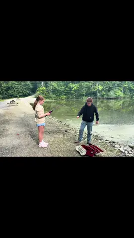 Big brother teaching his little sister to fish. This girl baited her own hook, and held her own fish! 