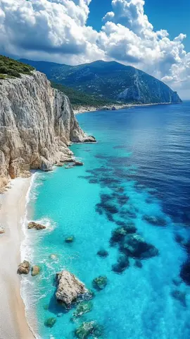 POV: You just found paradise 🌊☀️ Crystal-clear waters, towering cliffs, and skies that look painted. Who’s ready to dive in? 🏝✨ #BucketListVibes  #TravelGoals  #OceanViews  #ParadiseFound  #Wanderlust 