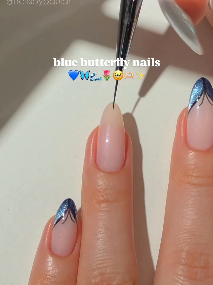 Sparkle that flutters. ✨💙🦋 This cat eye + butterfly nail look blends mesmerizing movement with high-shine dimension for a manicure that’s as captivating as it is creative. The perfect mix of ethereal shimmer and bold artistry—you won’t be able to stop staring. Nails by @nailsbypaular using @melodysusie: jelly pink jeweliver gel “Nude” 🫶🏻 blue cat eye gel “Galaxy Blue” 🦋 black gel polish “Black Abyss” 🖤 white gel polish “Snow White” ☁️ hema-free gel top coat ✨#mani #martini #buildergel #buildergeltutorial #americasbeautyshow