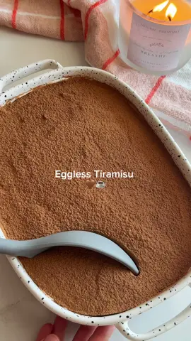 Eggless Tiramisu  I’m in love with tiramisu, and this quick, simple version is unbelievably delicious. Ingredients For the cream: 	•	300 g cold mascarpone cheese 	•	200 g heavy cream (min. 35% fat, very cold) 	•	70–90 g powdered sugar (adjust to taste) 	•	1 tsp vanilla extract (optional) For the coffee: 	•	250–300 ml strong coffee (espresso or instant, cooled) 	•	1 tsp vanilla extract (optional)       •.       2–3 tbsp coffee liqueur (Kahlúa, Tia Maria) optional For assembling: 	•	200–250 g savoiardi ladyfingers 	•	Unsweetened cocoa powder (for dusting)  Instructions 1. Prepare the coffee 	•	Make a strong coffee, let it cool completely. 	•	Add vanilla if desired. 2. Make the cream (eggless) 	1.	In a chilled bowl, whip the heavy cream with powdered sugar and vanilla until soft-firm peaks form. 	2.	Add the cold mascarpone and beat on low speed until smooth and creamy. (Do not overmix). 3. Assemble 	1.	Dip each ladyfinger 1–2 seconds in cold coffee. 	2.	Arrange a layer of soaked ladyfingers in your dish. 	3.	Spread a layer of cream on top. 	4.	Repeat the layers, finishing with cream on top. 	5.	Cover and refrigerate at least 6 hours (best overnight). 4. Finish 	•	Dust generously with cocoa powder right before serving. #tiramisu #eggless #EasyRecipe #bakingtiktok #CapCut 