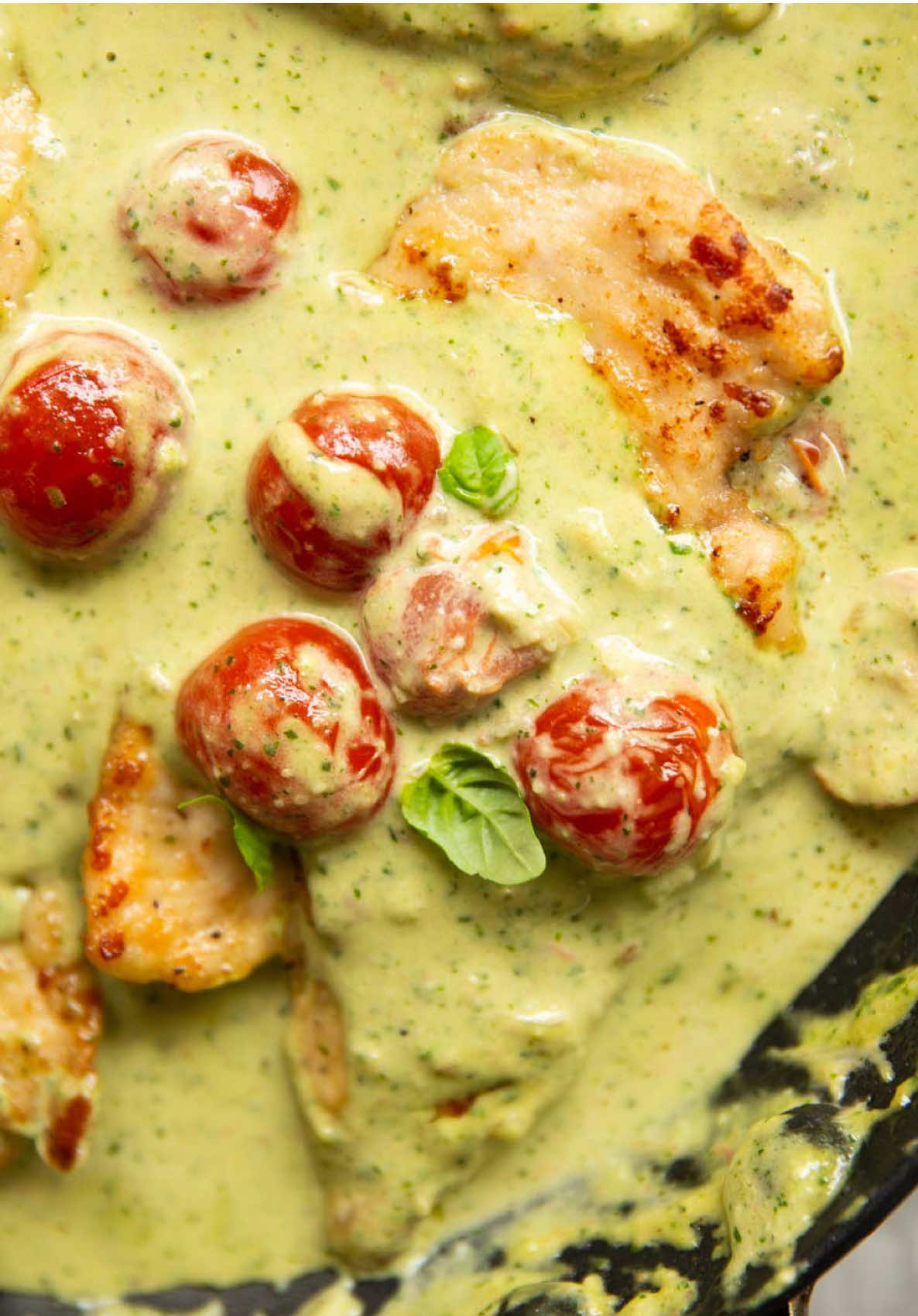 I think you’re going to be surprised at just how easy this dinner is to whip up. I served with crusty bread and a simple side salad, but there will be plenty of sauce so you could serve with potatoes, rice or even pasta! The recipe has just gone live on the blog - let me know if you give it a go 😄 Chris x *Recipe in more detail on the blog! CREAMY PESTO CHICKEN | Serves 4 INGREDIENTS ➡️CHICKEN 2x 250g/9oz Chicken Breasts 35g / 1/4 cup Plain Flour 1 tsp EACH: Salt, Garlic Powder 1/2 tsp Black Pepper 1 tbsp EACH: Olive Oil, Butter ➡️SAUCE 2 Shallots, finely diced 160ml / 2/3 cup Double/Heavy Cream 80ml / 1/3 cup Chicken Stock (I use 1/2 Oxo + 80ml hot water) 20g / 1/4 cup Freshly Grated Parmesan 200g / 7oz Cherry Tomatoes, halved 1/2 cup Pesto* METHOD 1️⃣Horizontally slice each chicken breast right through the centre to create 4 even-sized cutlets. In a large shallow dish, combine the flour, garlic powder, salt and pepper. One by one, coat the cutlets in the flour, give them a shake then place to one side. 2️⃣In a large pan over medium-high heat add 1 tbsp oil and butter. Once the butter has melted, add the chicken and fry both sides for a few minutes until golden on the outside and just about cooked through the centre. Remove and place on a plate to one side. 3️⃣Lower the heat to medium, then fry the shallots in the excess fat until soft and golden. Stir in the stock, cream and parmesan and simmer for a couple of minutes, or until the sauce thickens. Add the tomatoes and simmer for another couple of minutes until the tomatoes just begin to soften. 4️⃣Turn the heat to low, then swiftly stir in the pesto until it completely blends into a sauce. Stir in any resting juices from the chicken and adjust seasoning with salt and pepper if needed. Add the chicken back in, coat in the sauce then serve and enjoy!  *1 small bunch basil (30g/1oz) 3 tbsp extra virgin olive oil 2 tbsp pine nuts 1/4 cup / 20g freshly grated parmesan 1/2 small clove of garlic 1/4 tsp salt 1/8 tsp pepper Blitz in a food processor until smooth