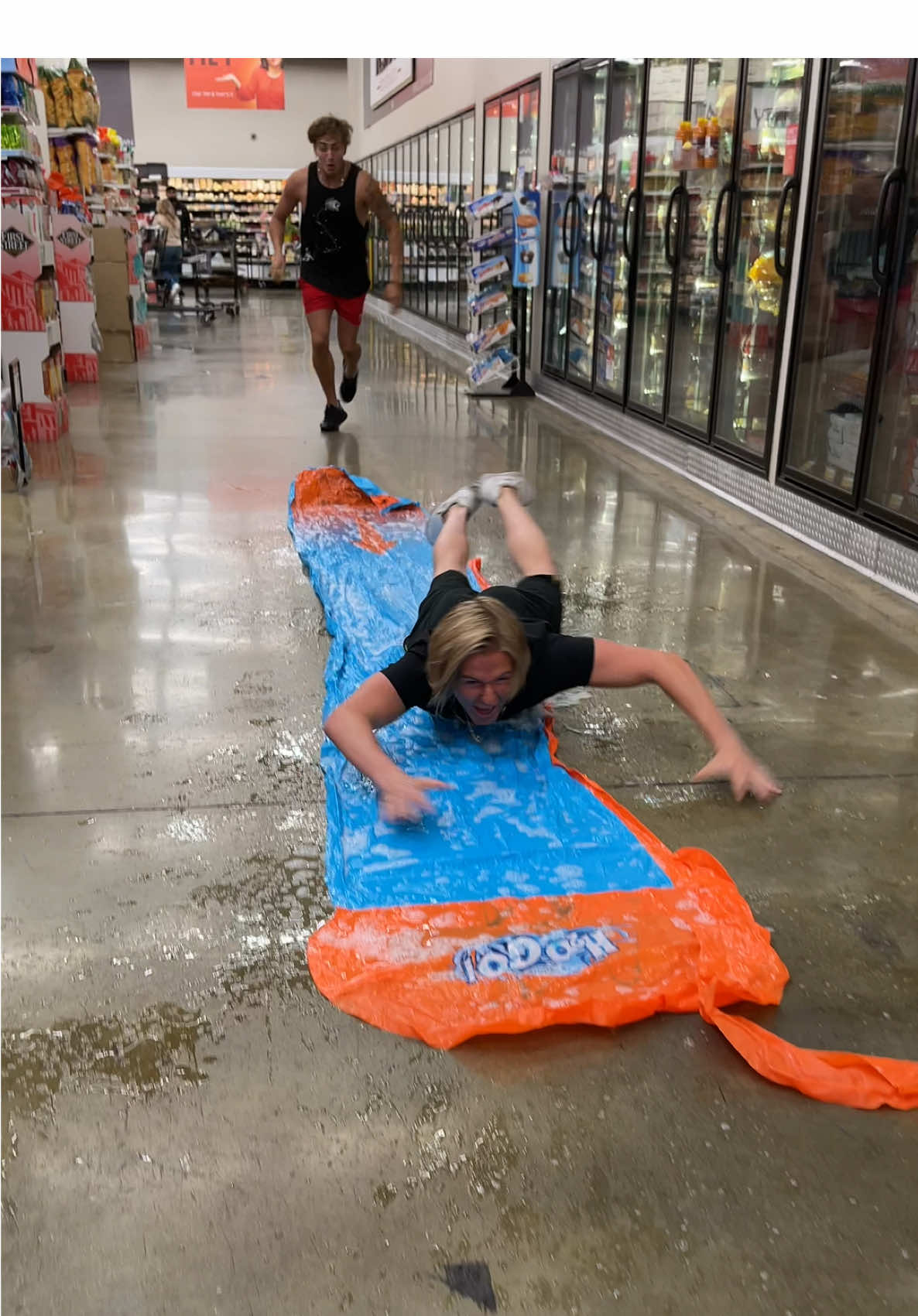 Replying to @Shane Nagy Slip ‘N Sliding Makes Us Happy 😃😂 #slipnslide #public #prank #friendshipgoals #karma    