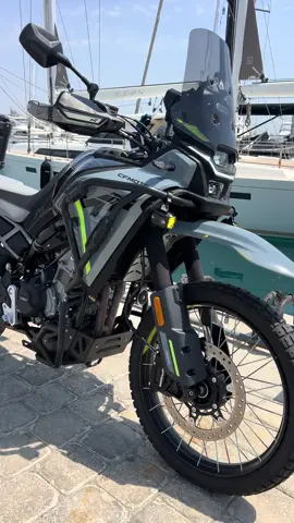Under the open sky, the 450MT roars by the harbor. The sea carries the echo, the ships stand still, and for a moment… the whole world feels yours.🔥#cfmoto450mt #viral #mototravel #adventurebike #motorcycle 