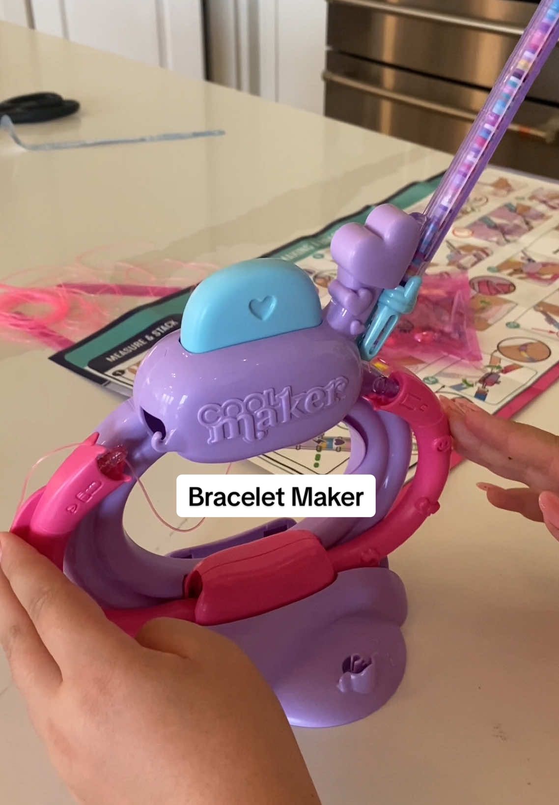 They restocked the viral bracelet maker and it’s such a great mom find! It will keep the kids busy while you get dinner cooking. Winning! #braceletmaker #makingbracelets #giftideasforkids 