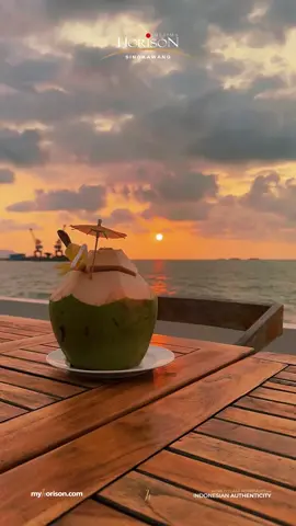 Sunset in fast-forward, coconut in slow sip. A perfect pause. 🌴🌅 #horisonultimasingkawang #horisonhotels #hotelsingkawang #horisonultima 