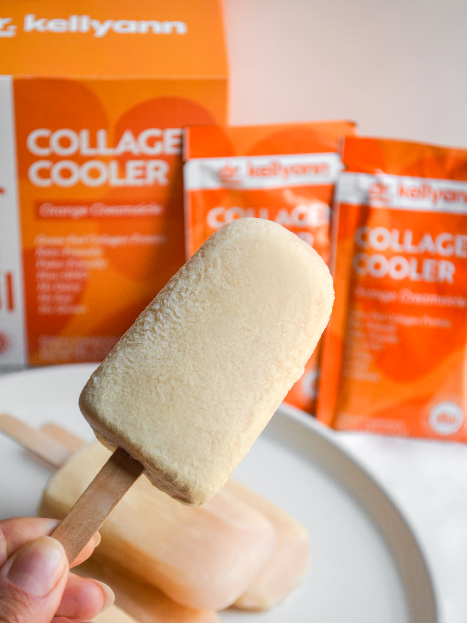 🍊Creamy, dreamy, and secretly packed with grass-fed collagen protein for hair, skin, and nails plus probiotics for digestion. These 4-ingredient Orange Creamsicle Pops are the ultimate summer snack! #Collagen #Popsicles #OrangeCreamsicle #Protein #SummerSnacks #skinhealth #DrKellyann #GutHealth