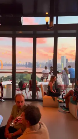 This evening I watched the sunset from one of NYC’s most spectacular perches, The Panorama Room, the rooftop bar atop the Graduate Hotel on Roosevelt Island. 🌇✨ Perched in the middle of the East River between Manhattan and Queens, Roosevelt Island is a slender, two mile stretch with a front-row seat to the city skyline. From up here, you get cinematic views in every direction, the Midtown towers glowing gold, the Queensboro Bridge stretching across the water.  You can take the F train straight to Roosevelt Island, or float above the East River on the iconic Roosevelt Island Tram, a 4 minute aerial glide with jaw dropping city views. #nyc #newyork #newyorkcity #bigapple #fun #vacation #holiday #fyp #sunset #rooftop #rooftopbar #Love 