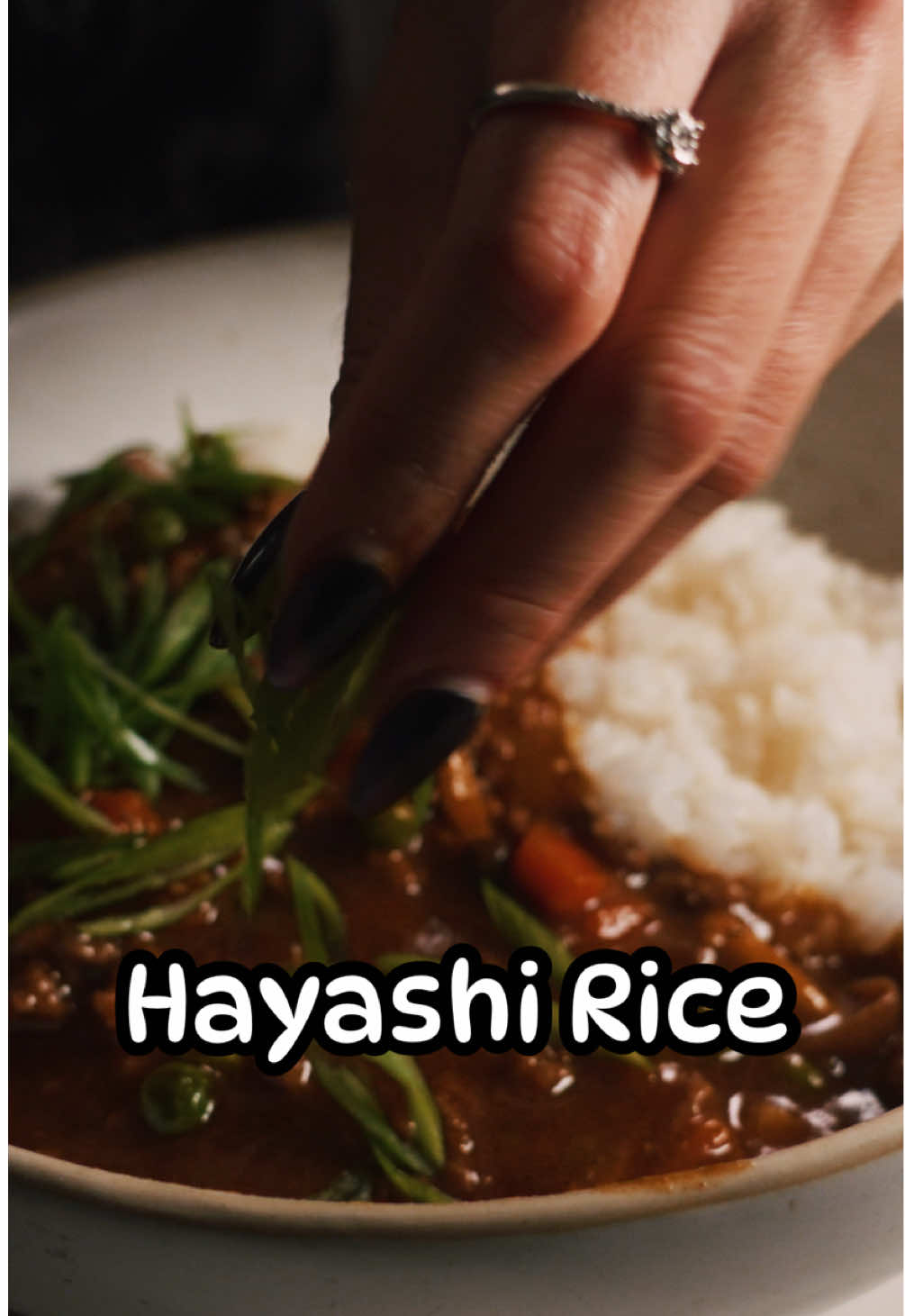 I ran out of the boxes so I decided to attempt to make it from scratch. You can definitely use the boxes if you are pressed on time. I just like to experiment whenever I have the time 😤 yes that is a big glass of wine… it was a long day at work 😅 Hayashi Rice Serves : 2-3 Time: 1 hour  Ingredients:  - [ ] 1/2 lb sliced beef or ground beef  - [ ] 1 pack of shimeji mushrooms  - [ ] 2 small carrot  - [ ] 3 stalks of celery - [ ] 1/4 cup of green peas, frozen (optional)   - [ ] 1/2 onion  - [ ] 3 cloves of garlic   - [ ] 1 tbsp tomato ketchup - [ ] 1/4 cup red wine - [ ] 1/2 cup Japanese demi-glace sauce  - [ ] 1 tbsp of tomato paste - [ ] 1 cup low sodium-beef stock  - [ ] 1 cup of water (**)  - [ ] 1 bay leaf  - [ ] 1 tbsp of brown sugar  - [ ] 1 tbsp Worcestershire sauce - [ ] 2 tbsp of shoyu   Roux:  - [ ] 1 tbsp butter (15g)  - [ ] 2 tbsp flour (15g) - [ ] 1/2 cup low-sodium beef stock  Instructions: 1. Slice onions, carrots and celery. Slice mushrooms if not using shimeji. Mince garlic.  2. Melt butter in saucepan over medium-low heat.  3. Add flour.  4. Using a wooden spoon, mix flour and butter stirring constantly.  5. Continue to cook, stirring constantly until the roux is a deep caramel brown. Be careful not to burn the roux.  6. Remove from heat and add beef stock stirring constantly until roux becomes a thick paste. Set aside.  7. Season beef with salt and pepper. 8. Then lightly sear the beef. It’s okay if beef is slightly pink. We will cook this more later. Set aside beef in a separate plate.   9. Then in the same saucepan, melt butter and oil.  10. Add mushrooms, onions, carrots, celery, and saute till softened and golden. Then add in garlic, cooking until fragrant.  11. Then add ketchup, red wine, demi-glace, beef stock, water, sugar, bay leaf, tomato paste, Worcestershire sauce, and shoyu to the pan. 12. Simmer for five minutes.  13. Add roux and stir gently till well incorporated. 14. Add peas and beef and cook for an another 2-3 minutes until thickened. Make any last minute adjustments such as salt, pepper, or brown sugar if you want to sweeten it.  15. Finish with cracked pepper if desired and serve with rice! 16. Enjoy!  **Notes: this recipe was still in the testing phase so I decided to use water instead of more beef broth but I think 2 cups of low-sodium beef broth would make this even richer and beefier. You may have to adjust the ratios of shoyu and to balance out the salt.  #asmrcooking #recipes #foodasmr #vtuberen #fyp 