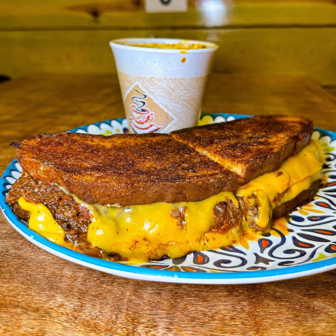 Is it a grilled cheese? Is it a melt? Idk, but it’s stuffed with birria and it slaps. Argue in the comments while I finish mine 🤷🏽‍♀️🔥 📍 4312 W Fullerton, Chicago 🌐 tacotlan.com #birria #grilledcheese #melt #chicagorestaurants #fyp  