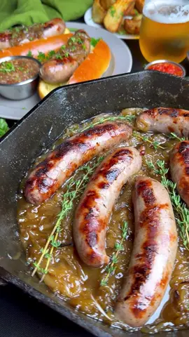 Celebrate National Bratwurst Day with these Smoked Beer Brats and Onions! 🔥 Ingredients: 8- 3.8 oz Omaha Steaks Gourmet Bratwursts 5 large vidalia onions, thinly sliced 24 oz. beer of choice 1 tablespoon Omaha Steaks Seasoning 4 tablespoons butter ⅓ cup brown sugar 2 tablespoons fresh thyme 8 brioche buns Directions: 1. Place brats and sliced onions in a two-gallon zip top bag. Pour the beer into the bag, remove as much air as possible and seal. Place the bag in a bowl and then into the refrigerator for at least 6 hours, but overnight if possible. 2. Remove the brats from the refrigerator and place on the counter while you prepare the grill. Light your grill and set up for two zone heat. Add an optional chunk of pecan wood for added smoke flavor. Close the lid and establish temperature in the grill at 375°F. 3. Remove the onions and brats from the bag and place them into a 14” cast iron skillet. Add half of the beer from the bag to the skillet and season with Omaha Steaks Seasoning. 4. Place the skillet on the grill over indirect heat. Close the lid and allow the brats to boil in the beer for 30 minutes. 5. Remove the brats from the beer and set aside. Move the skillet to position it over direct heat. Add the butter and brown sugar to the onions and allow the liquid to cook out until the onions are dark in color and liquid has cooked off. Add in the thyme and combine; move pan to indirect heat. 6. Place the brats over direct heat and sear the outside. Flip them often to ensure they don’t burn, for a total of about 5 minutes. 7. Remove the onions and brats from the grill. Place the brats in the buns and top with onions, serve with Omaha Steaks Gourmet Steakhouse Fries. 📸 Grillseeker #omahasteaks #nationalbratwurstday #bratwurstday