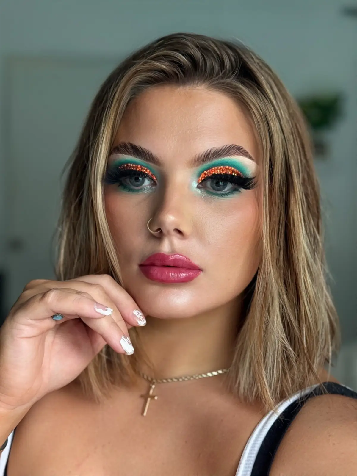 ⸻ ✨ My spin on a #TheLifeOfAShowgirl–inspired glam, channeling @Taylor Swift ✨ From sparkling oranges to aqua blues and a pop of pink lips 💎🎭 Yes… I spent over an hour gluing these tiny rhinestones on one by one 👀😂 so please show her some love 💖 #TaylorSwift #T#TaylorSwiftMakeupS#SwiftieGlamShowgirlEra