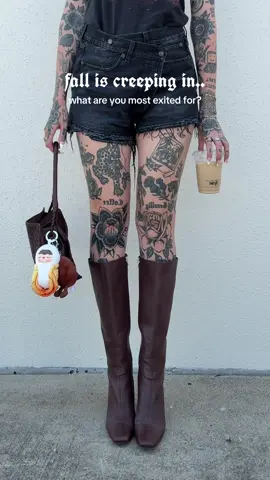 I’m most excited to switch my bag charms to Halloween fall vibes and fall iced coffee recipes!! 🍂🎃  #halloween2025 #fallaesthetic #halloweenishere #girlswithtattoos #alttok 