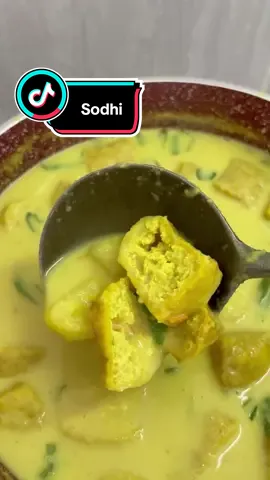 What to eat today? Sodhi! The perfect combo with any Sambal. Easy and Super Delicious                                    Servings : 5 - 6 Pax …………………..…………………..  Ingredients: - Potatoes - 2 (Diced) - Onions - 3 - Tomato - 1 - Garlic - 1 Bulb - Cili Padi - 4 - Tau Pok - 6 Pcs  - Turmeric Powder - 1 tsp - Salt - 1 tsp - Asam Jawa  - Evaporated Milk  - ⁠Santan (500gm)  …………………..…………………..  Steps: • Cut potatoes into cubes • ⁠Marinate potatoes with a pinch of salt • ⁠Cut tau pok into small sizes • ⁠For Blending : Add a little water together with the Garlic, Cili Padi, Tomato and Onions • ⁠With high Fire : Add the blended paste into the cooking pot • ⁠Add 1tsp Turmeric  • ⁠Add 1tsp Salt • ⁠Squeeze Asam Jawa according to your own sourness  • ⁠Stir and Cook till it boils (Roughly about 10 - 15mins)  • ⁠Add potatoes  • ⁠Add Tau Pok • ⁠Add 500gm of Santan (For thickness, adjust amount to liking) • ⁠Add some evaporated milk (adjust accordingly to the color of liking)  • ⁠Add Curry Leaves  • ⁠Off Fire #supercooker #makanmakananibu #fyp #FoodTok #homecooked 