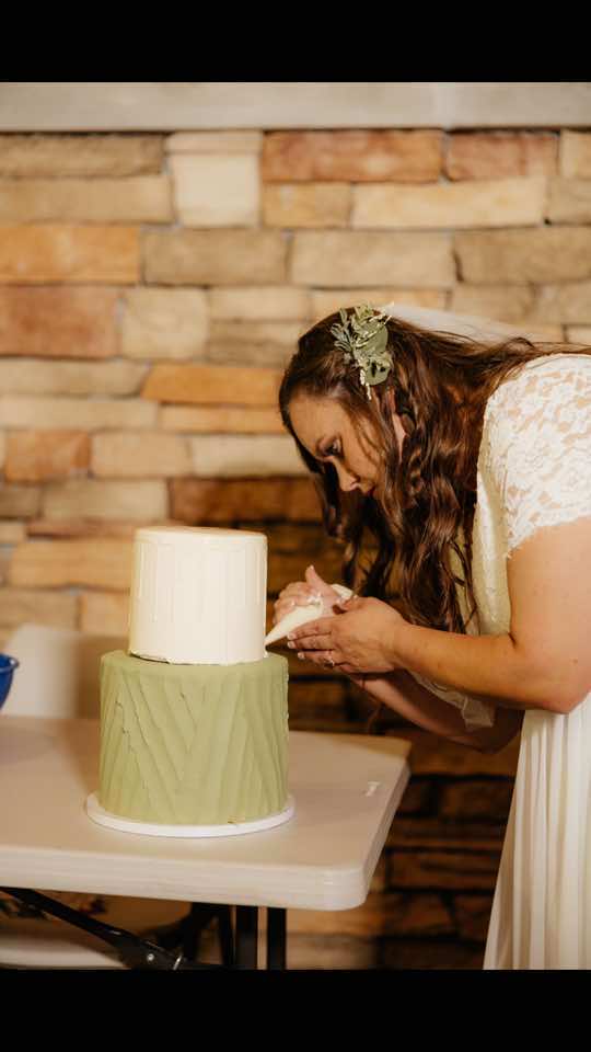 Yes, I decorated my wedding cake in my wedding dress at the reception with my husband’s help, and yes, I would do it again. @Jeff  #cake #cakedecorating #wedding #weddingtiktok  #weddingcake 