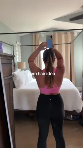 two half up pig tails. knotted those two ends into each other twice. put it all in a pony tail. boom - cute easy gym hair. 