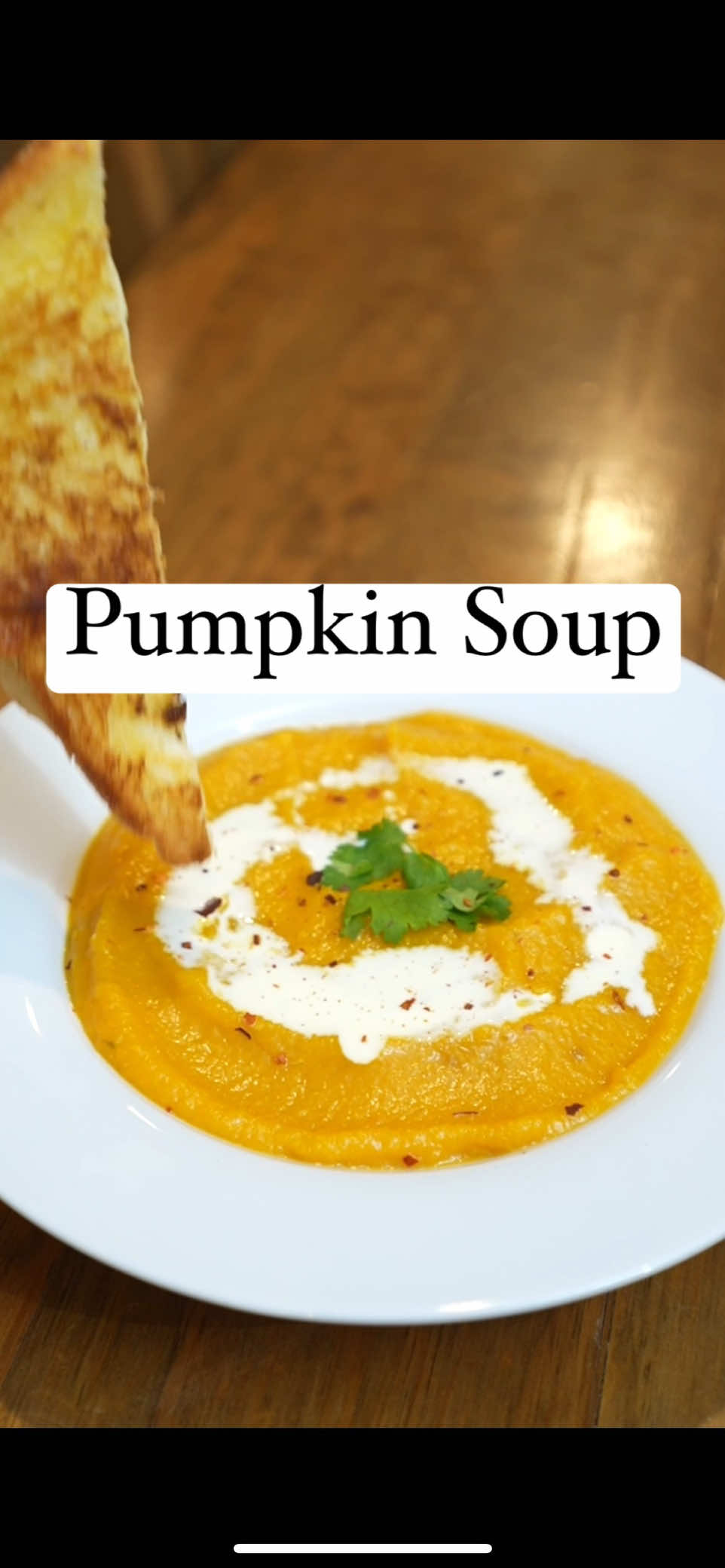 RECIPE serves 8 (or 4.5 Samoans) 1 pumpkin (approx 2.7 kg) 2 tomato 1 large potato 4 cloves of garlic 2 celery stalks 1 large onion ⅓ C olive oil (or any oil) 750ml - 1L vege/chicken stock 1 tbsp garlic powder 2 tsp coriander 2 tsp onion powder Salt & pepper to taste ½ Cup of cream for serving (or coconut cream) -Preheat oven to 200 Celsius on bake setting -Peel & roughly chop pumpkin, tomato, potato and add to a baking dish. -Pour olive oil over vege & season with salt & pepper -Put in oven to roast for about 35-45 mins til very tender when poked with fork -While vege in the oven, chop your carrots, celery, onion & garlic into smallish pieces  -Heat oil in a large pot & fry carrots, celery and onion for 5-8mins on medium low heat til softened. If it begins to stick to the pot add 1-2tbsp of stock or water to deglaze (get sticky bits off bottom of the pot, not bottom of your bottom) -Add garlic & fry another 1 minute -Remove from heat until oven veges are ready -Bring pot back up to med low heat, & add oven vege to the aromats (celery, carrot etc) -Add seasonings (you can also experiment here & add others than what I’ve listed!) -Use a stick blend til smooth(ish) & add abt 750ml of chicken/vege stock. If you dont have liquid stock you can use stock cubes dissolved in boiling water (follow pack instructions for ratios). If you don’t have stick blender you can mash instead but consistency will be chunky. Dont mash on your cooktop!  -Season with salt & pepper and mix again -If soup is too thick, add more stock. Taste & adjust seasonings.  -Serve with cream, chilli flakes & a toasted sandwich!  #Pumpkinsoup #EasyRecipe #SoupRecipe #PumpkinRecipe 