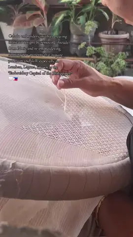 Calado embroidery involves creating intricate designs by removing threads from fabric and re-embroidering, forming new patterns that require precision and skill, especially in Lumban, Laguna, known as the 