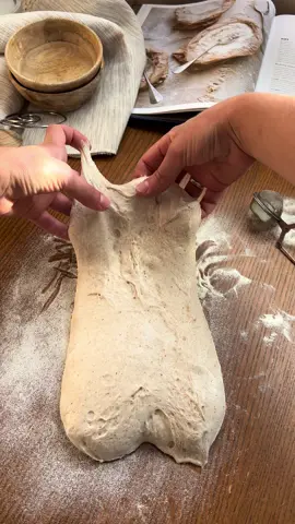 Shaping Sourdough Batard (Oval) Bread 🥖🤍 Sourdough Bread with Buckwheat Flour Ingredients:  630 g bread flour  70 g dark buckwheat flour  7 g dry rye malt (optional)  476 g water  140 g active sourdough starter (100% hydration)  16 g salt Dough temperature during fermentation: 25°C (77°F) Warm fermentation: ~6 hours Cold fermentation: ~12 hours Method:   🥣 Combine all ingredients in a bowl until fully incorporated.    🕛 Let the dough rest for 1 hour, covered. 🤲🏻 Perform one gentle stretch & fold.   🕛 Let it rest for 1 hour. 1️⃣ Perform the first coil fold.   🕛 Let it rest for 1 hour.   2️⃣ Perform the second coil fold.   🕛 Let it rest for 1 hour. 3️⃣ Final third coil fold.   🕛 Let the dough ferment for 2 more hours.   🤲🏻 Shape the dough into a round or oval (depending on your banneton shape), and place it seam-side up into a floured proofing basket.   ❄️ Refrigerate overnight (about 12 hours). ⏲️ In the morning, preheat your oven to 250°C (482°F) with a Dutch oven, baking steel, or baking stone inside. Preheat for at least 40 minutes. For open baking : Place a metal tray filled with clean stones or lava rocks at the bottom of the oven.   🔪Take the dough out of the fridge, score it, and place it into the preheated Dutch oven or onto the baking steel (stone). Bake at 250°C (482°F) for 20 minutes with the lid on or with steam (open baking method). 💨 For open baking: Right before loading the dough, carefully pour 1 cup of boiling water into the preheated tray with stones to create steam. Immediately close the oven door to trap the steam. Be careful — hot steam will rise quickly! 🍞Remove the lid or release the steam. Lower the oven temperature to 200°C (392°F) and continue baking for another 20 minutes, or until the crust is deep golden brown. ❤️ Like, save & share if you love sourdough bread. Got questions? Drop them below — I’d love to answer. Don’t forget to follow for more beautiful sourdough bakes 🤍 #sourdough, #sourdoughbread, #buckwheatbread, #homebaking, #artisanalbread
