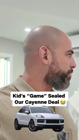 A kid's game sealed our Porsche Cayenne deal. Wait til you see it. #porsche #cayenne #carnegotiation #usedcars #cardealership 