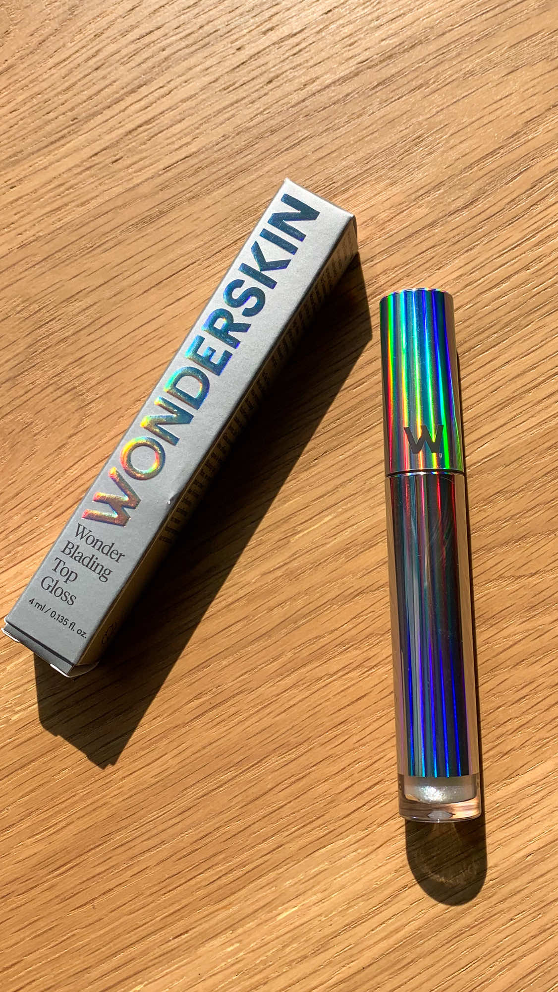 My drop from @Iris app - @Wonderskin Beauty WONDER BLADING Top Gloss in Holographic. Such a pretty shade, love it. #makeup #lipgloss #irisapp #wonderskin 