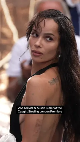 #ZoeKravitz stuns in a plunging halterneck gown, getting close with co-star #austinbutler at the London premiere of #Caughtcheating  Credit: Getty Images 