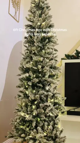 My dream Christmas tree, slim with snow and just Christmas lights as decor. #christmas #christmastree #slimchristmastree #viralchristmastree #christmastreewithfreeheadress 
