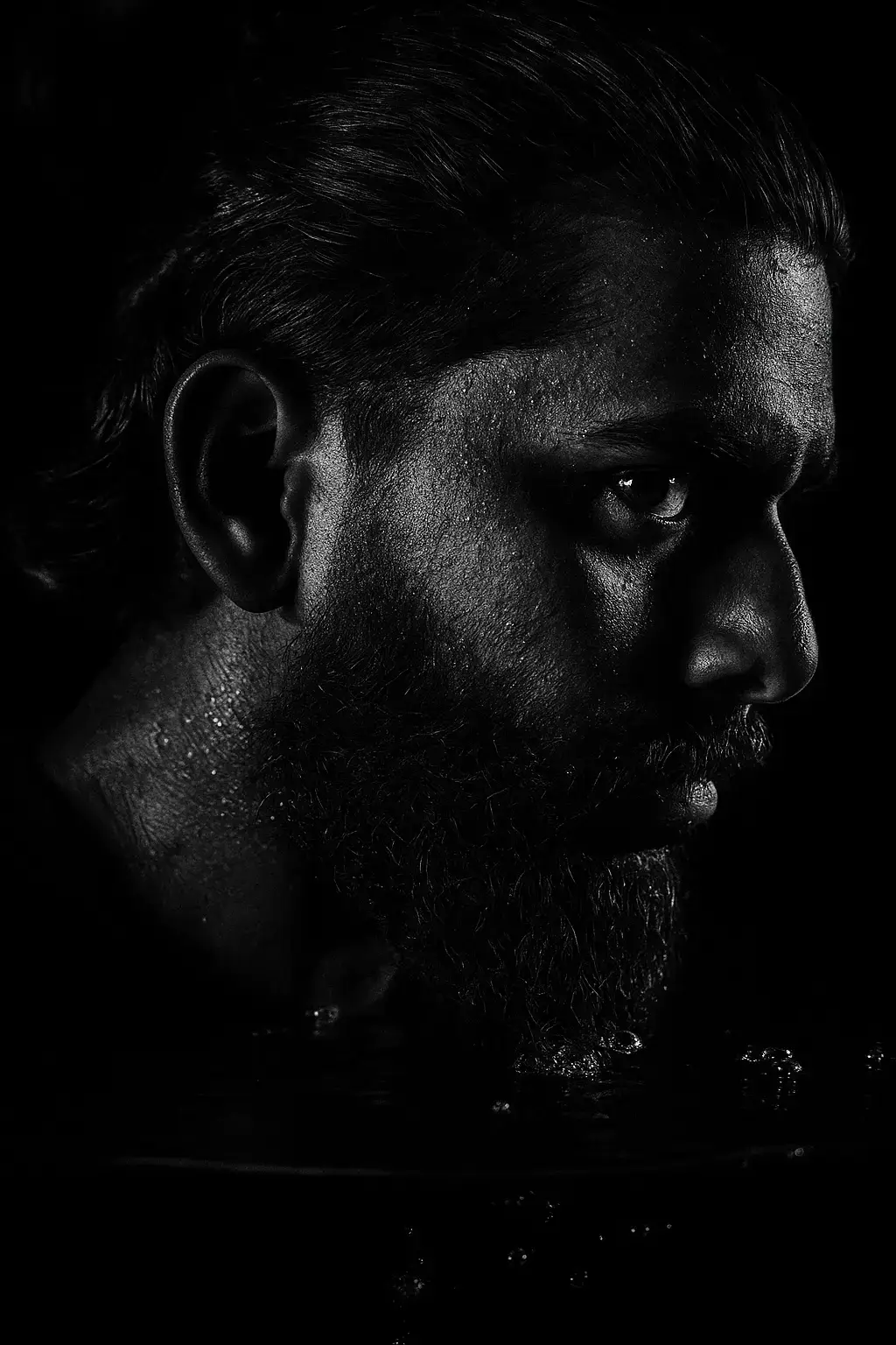 1 - Open ChatGPT 2 - Upload your Image  3. Type ( Create a high contrast black and white close up portrait of the man in the picture. The image should depict only the right half of his face, partially submerged in water with droplets and bubbles visible on his skin and hair, illuminate the right side of the face dramatically, casting the rest into deep shadow, dark background, detail in skin texture, beard stubble and eye focus to evoke a moody cinematic atmosphere. 4-Finally Generated Your Image like that.🖤 #creatorsearchinsights #chatgpt #trending #foryou #100k 
