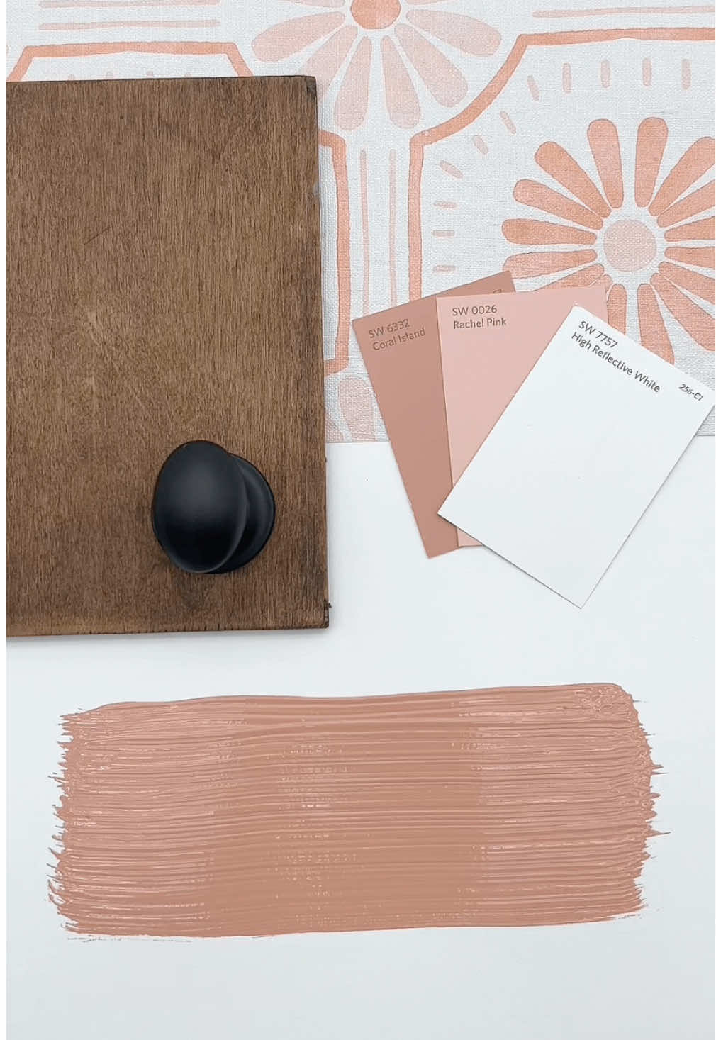 Sherwin Williams Coral Island is a lively, coral color that instantly adds energy and personality to any space.  Bold enough to be a statement, yet its warm, sun-kissed undertones keep it approachable instead of overwhelming. Because Coral Island is so vibrant, it shines best paired with fresh neutrals or soft whites that let it take center stage.  Try it on a front door for instant curb appeal, an accent wall in a sunny kitchen, or a creative workspace where you want extra spark. Even in small doses—like chairs, cabinetry, or a powder room—it brings a pop of joy and personality. ✨ Want a link for the wallpaper, swatches, or hardware? See Design Boards in profile link.  #paintcolors #interiorpaint #wallpainting #sherwinwilliams @Loomwell Home Goods @sherwinwilliams @HGTV Home® by Sherwin-Williams
