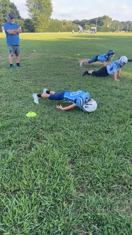 My little man hates warm ups at practice! Brings back memories! #football #popwarnerfootball #warmup #pushups #idontwanna 