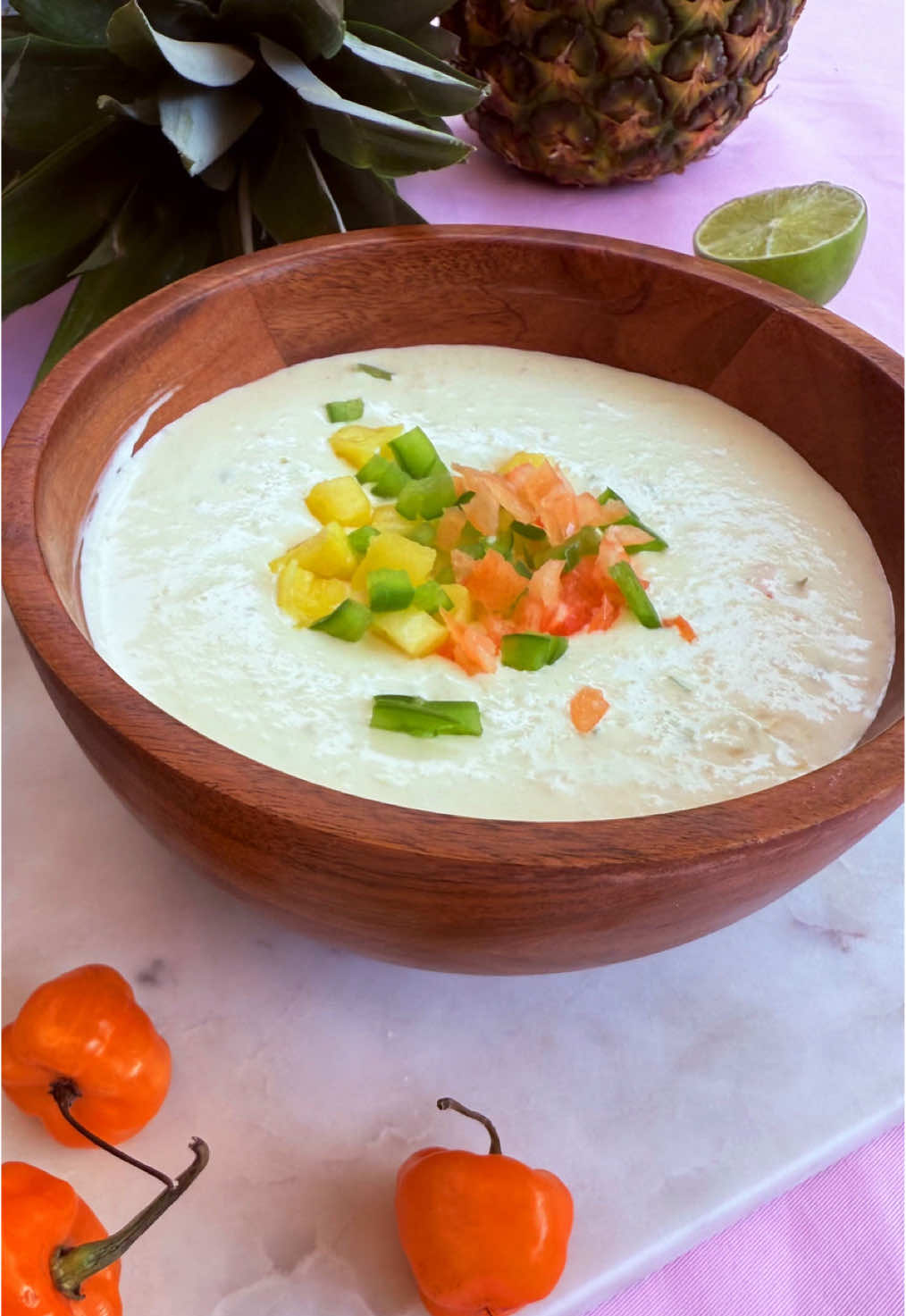 This sweet and spicy pineapple habanero dip is a dupe for the popular Costco dip that's only sold in the summertime! Find @Elise full recipe  below:   Ingredients 	•	4 ounces green pepper 	•	2 to 3 habanero peppers 	•	12 ounces cream cheese, softened 	•	1-1/2 tablespoons whole milk 	•	1 tablespoon pineapple juice 	•	2 rings fresh pineapple (about 2/3 cup) 	•	3 ounces finely shredded Monterey Jack cheese 	•	3 teaspoons pure cane sugar 	•	1 teaspoon garlic powder 	•	1 teaspoon onion powder 	•	1 pinch salt 	•	Pita chips Directions 	1.	In a food processor, combine green pepper and habanero. Pulse until finely chopped. Add cream cheese, milk and pineapple juice; process until well combined. Add pineapple, cheese, sugar, garlic powder, onion powder and salt; process until smooth. Transfer to serving bowl. 	2.	Garnish with additional diced pineapple, green pepper and habanero. Chill 1 hour. Serve with pita chips.