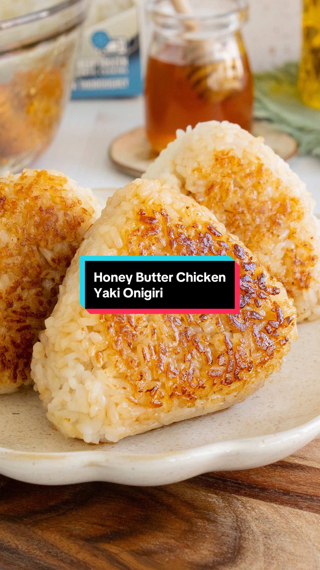 HONEY BUTTER CHICKEN YAKI ONIGIRI | Welcome to the Triangle of Tasty Honey Butter Chicken. 🍙🍯🧈🍗 RECIPE 1 box InnovAsian Crispy Honey Chicken 1 box InnovAsian Sticky White Rice 2 tbsp unsalted butter, melted 1 tbsp honey 1 tbsp soy sauce INSTRUCTIONS Prepare InnovAsian Crispy Honey Chicken and Sticky White Rice according to their package directions. When the chicken is cooked, dice it into small pieces. Mix in the honey sauce. Using an onigiri mold or your hands, fill the rice balls with a spoonful of the chicken and form them into a compact triangular shape. (If using your hands, wet them with water to prevent the rice from sticking.) In a small bowl, mix together the melted butter, honey and soy sauce. Brush the sauce onto both sides of the onigiri. Heat a pan over medium heat. Add the onigiri to the pan and cook for 2–3 minutes on each side until browned and caramelized. Remove the onigiri from the pan and brush with any leftover honey butter. Enjoy! #onigiri #yakionigiri #rice #easymeals #Recipe